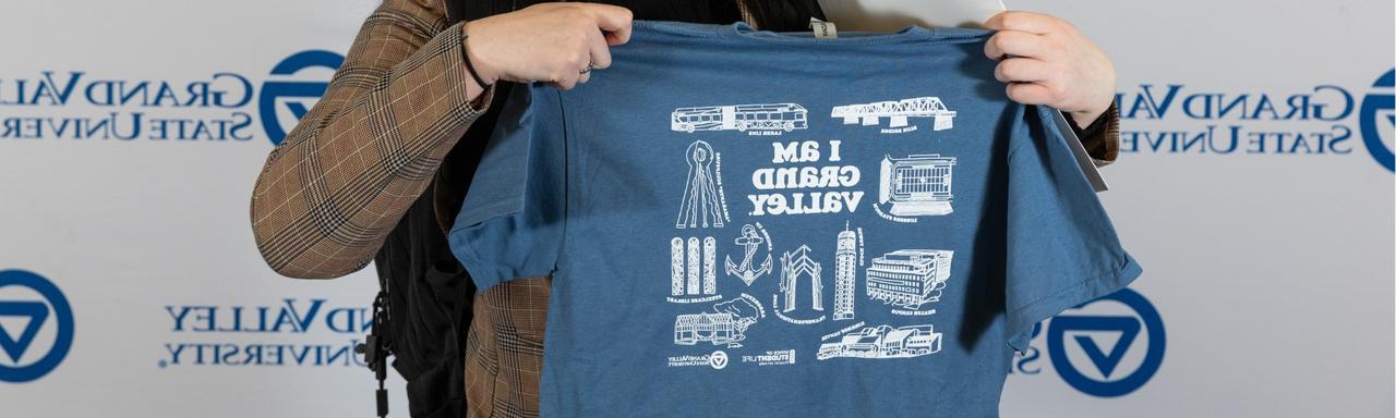 T-shirt with text that reads "I am Grand Valley" and assorted GVSU icons